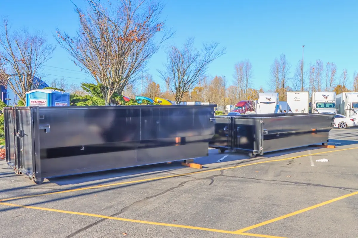 Professional dumpster rental service with roll-off container on residential driveway in Gillette